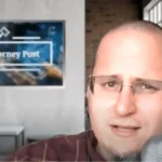 man speaking on a microphone