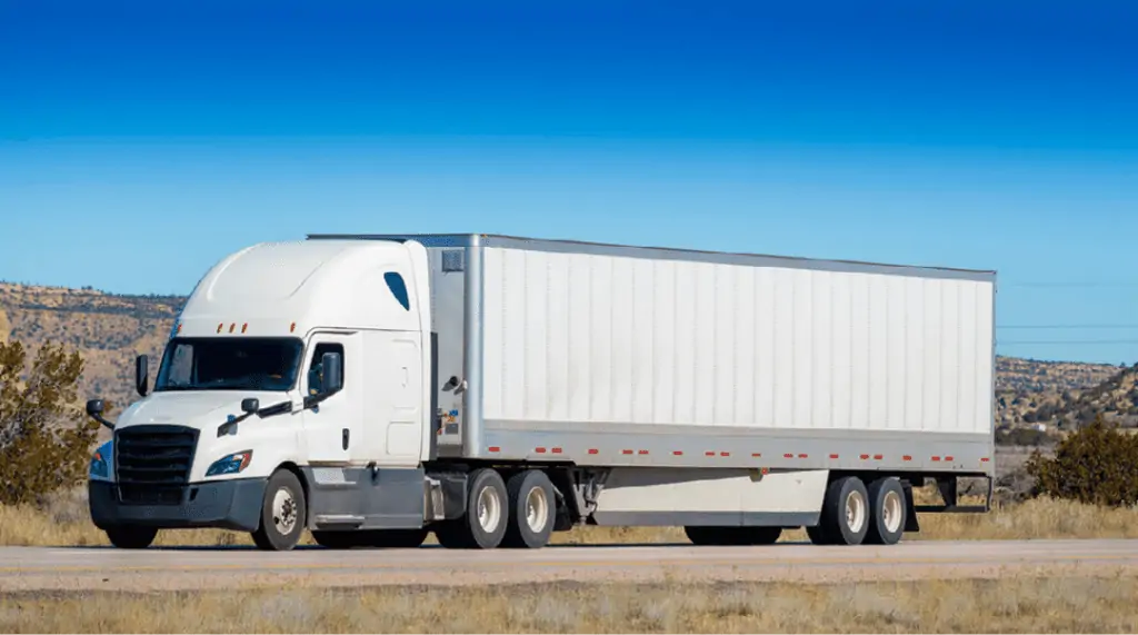 An 18-wheeler semi-truck traveling on a Texas highway.