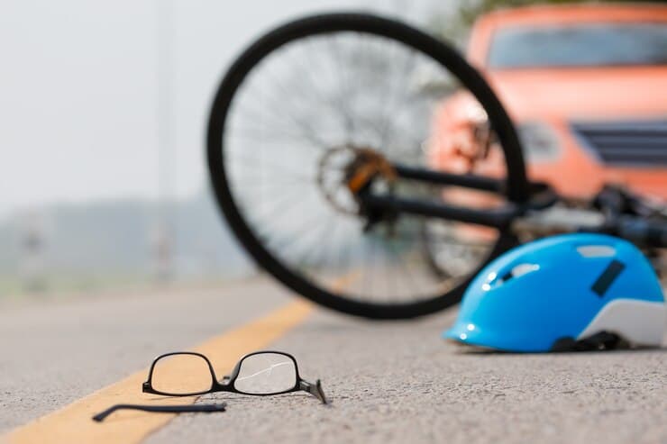 Accident involving a car and a bike, highlighting the dangers of road accidents and relevant for personal injury claims.