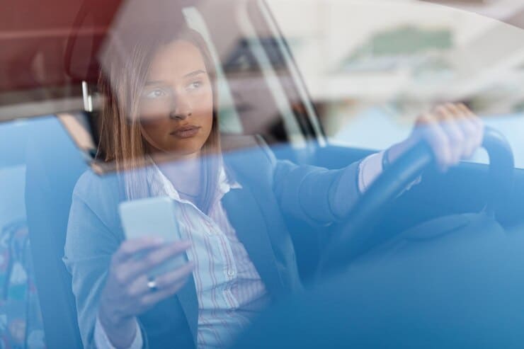 Woman using phone for texting while driving accident lawyer Austin