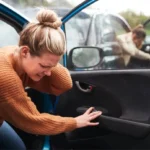 Person suffering from accident injuries after an car collision.