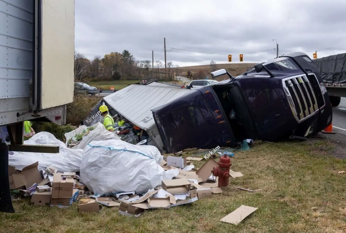 Two trucks involved in a fatal accident, with one truck's contents destroyed due to the crash, highlighting the severity of truck collisions and relevant for personal injury claims.