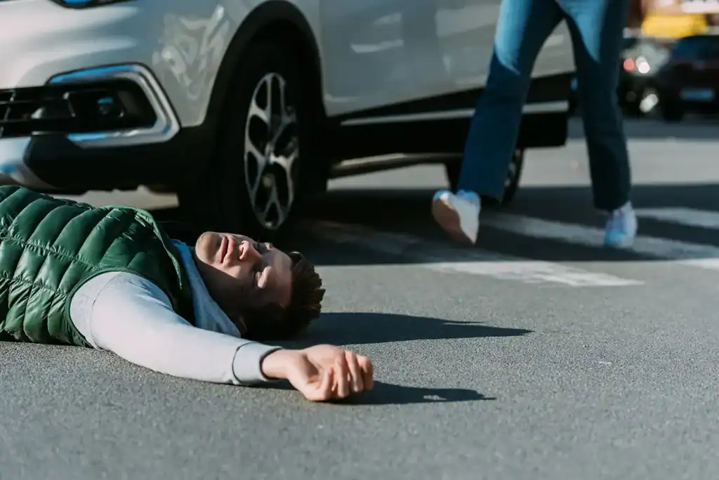 Injured man on road, pedestrian accidents