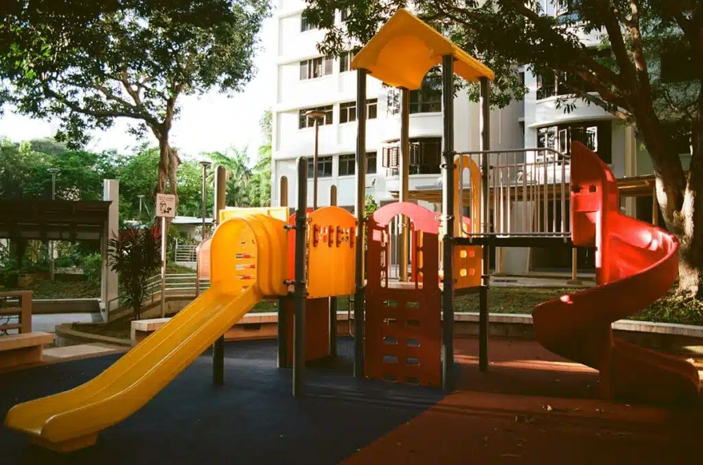 An empty colorful daycare playground with slides
