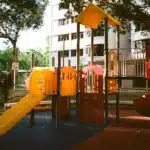 An empty colorful daycare playground with slides