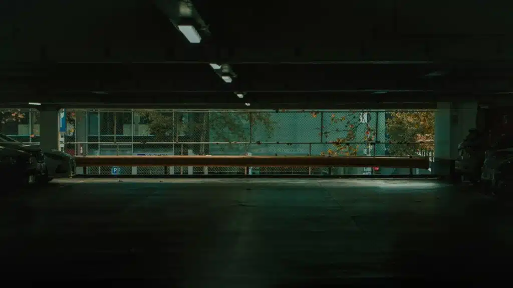 Dimly lit, empty parking garage illustrating a negligent security hazard